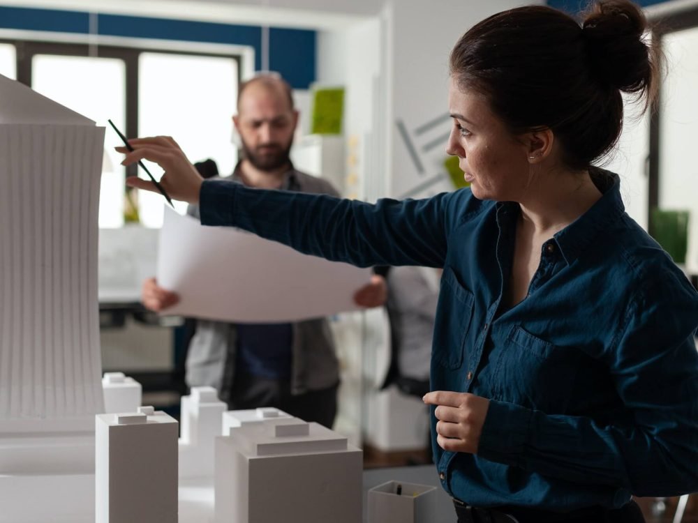 architecture-office-partners-looking-at-blueprints-and-plans-1.jpg