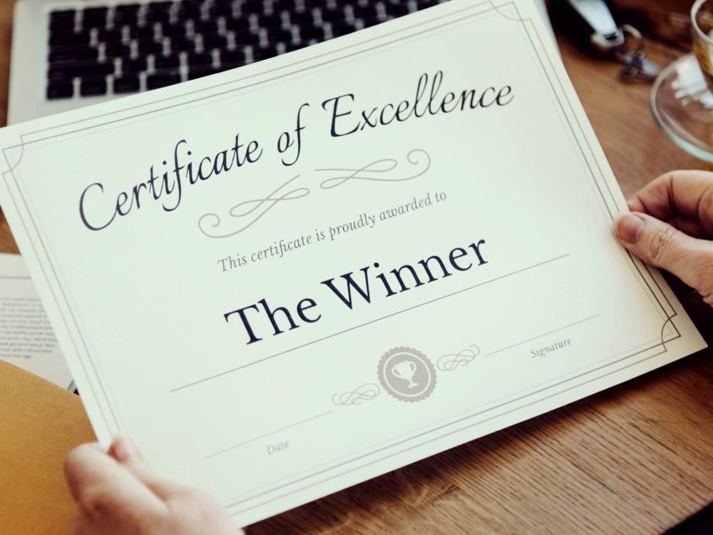 senior-adults-reading-holding-certificate-concrpt-1.jpg